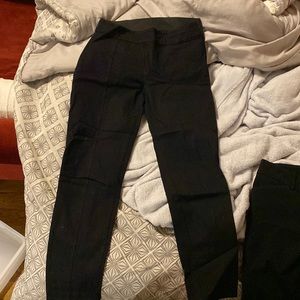 Black ankle-length trousers with elastic waistband